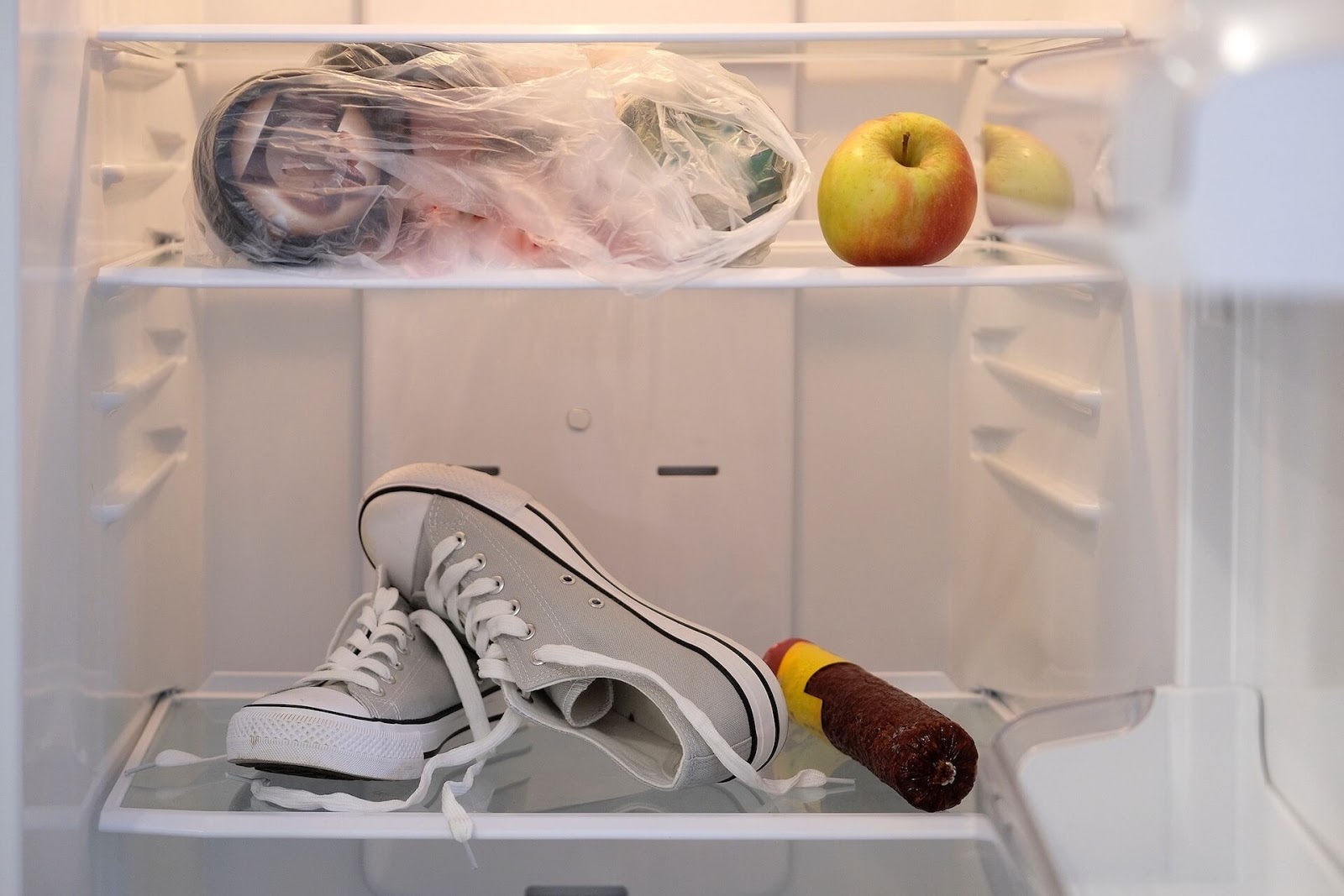 Some grey converse sneakers in the freezer