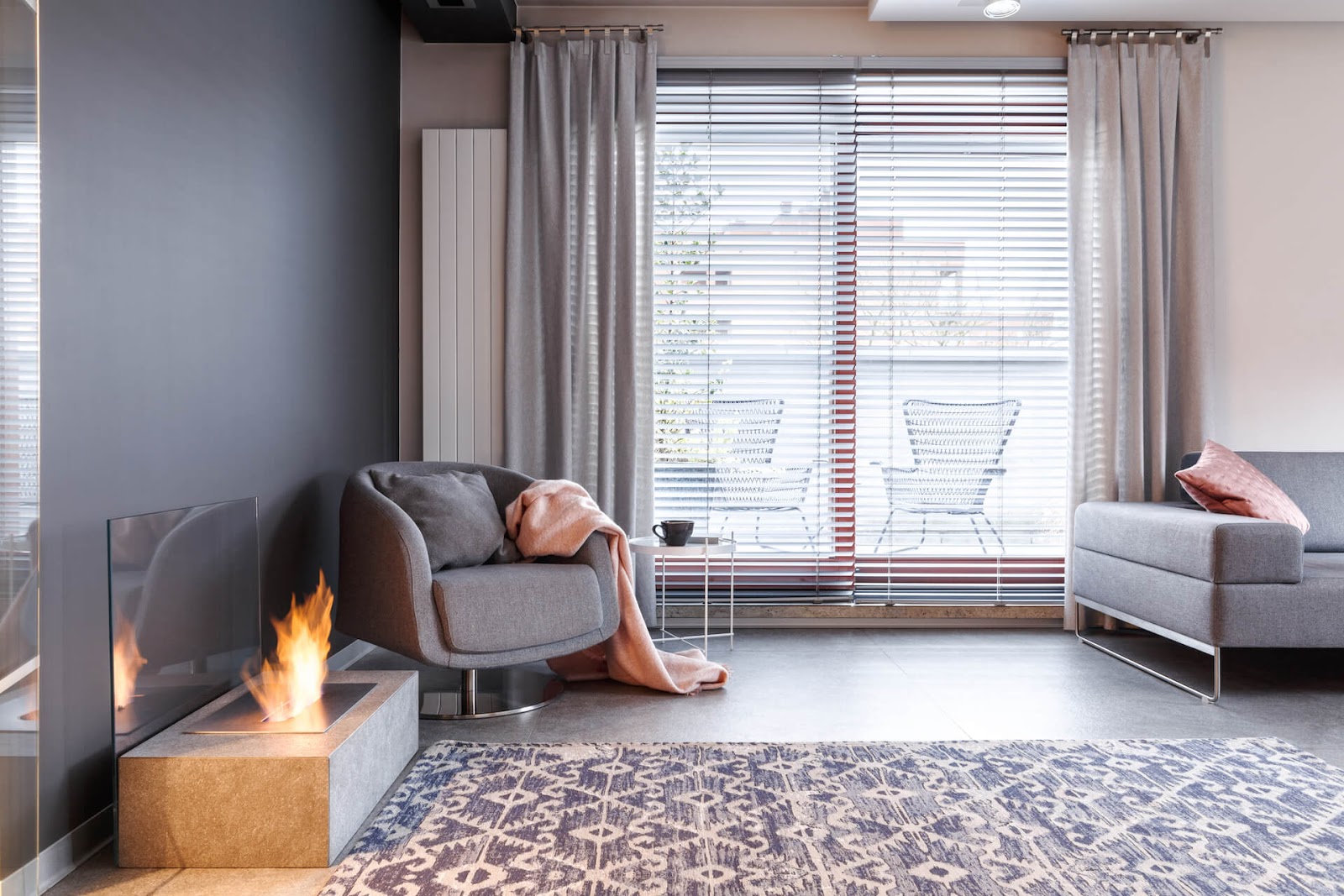 Modern living room with fireplace and stationary curtain panels