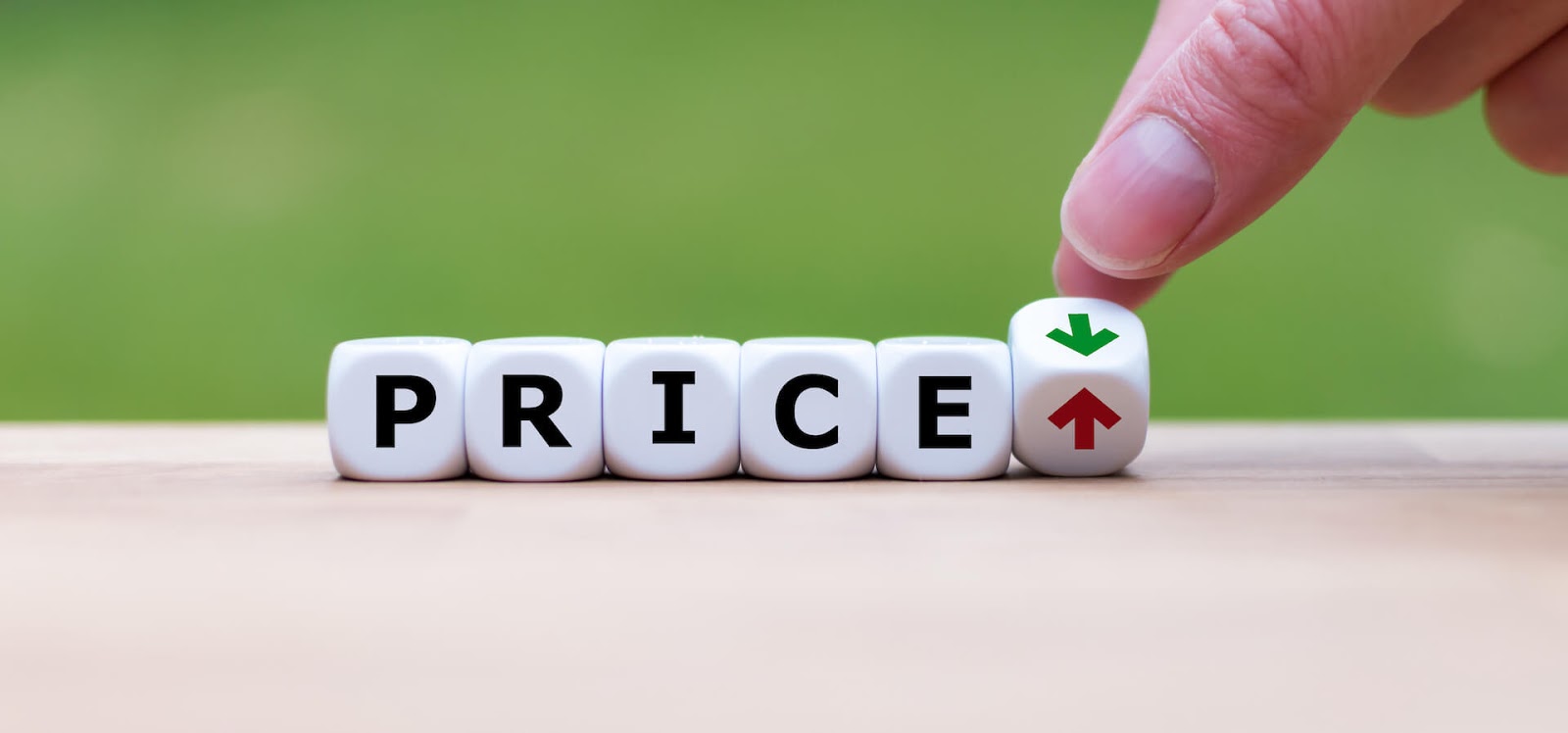 Lettered dice that say Price with a hand moving an arrow up or down afterwards