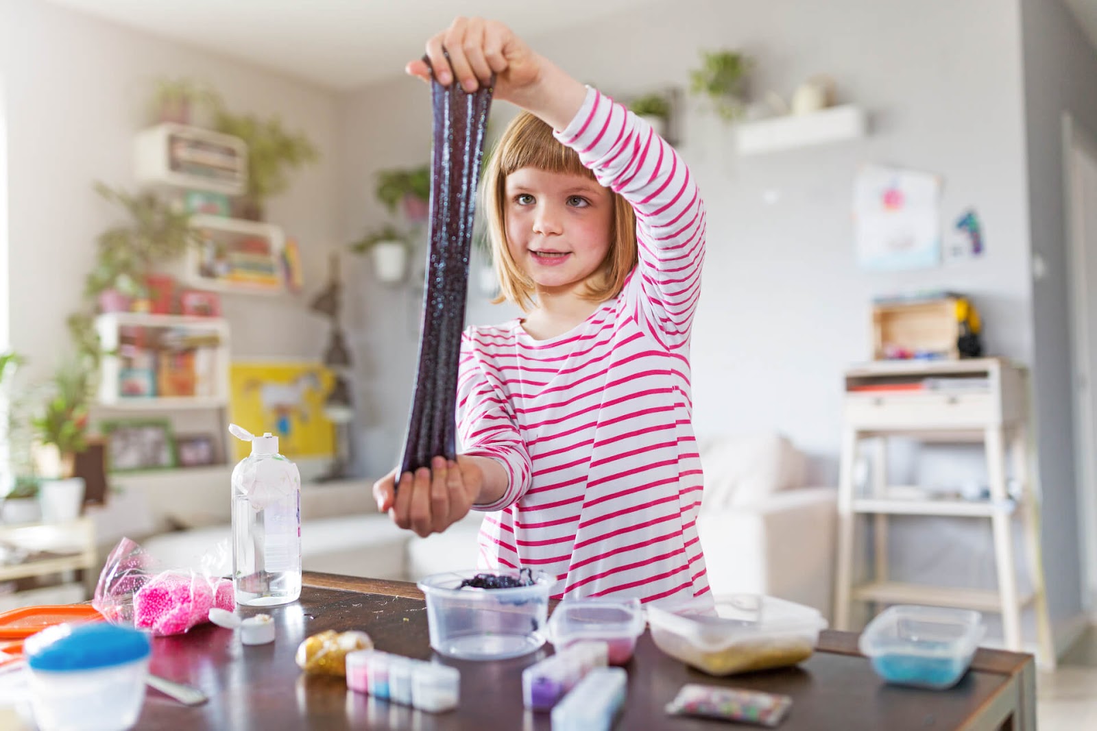 Girl stretching homemade slime