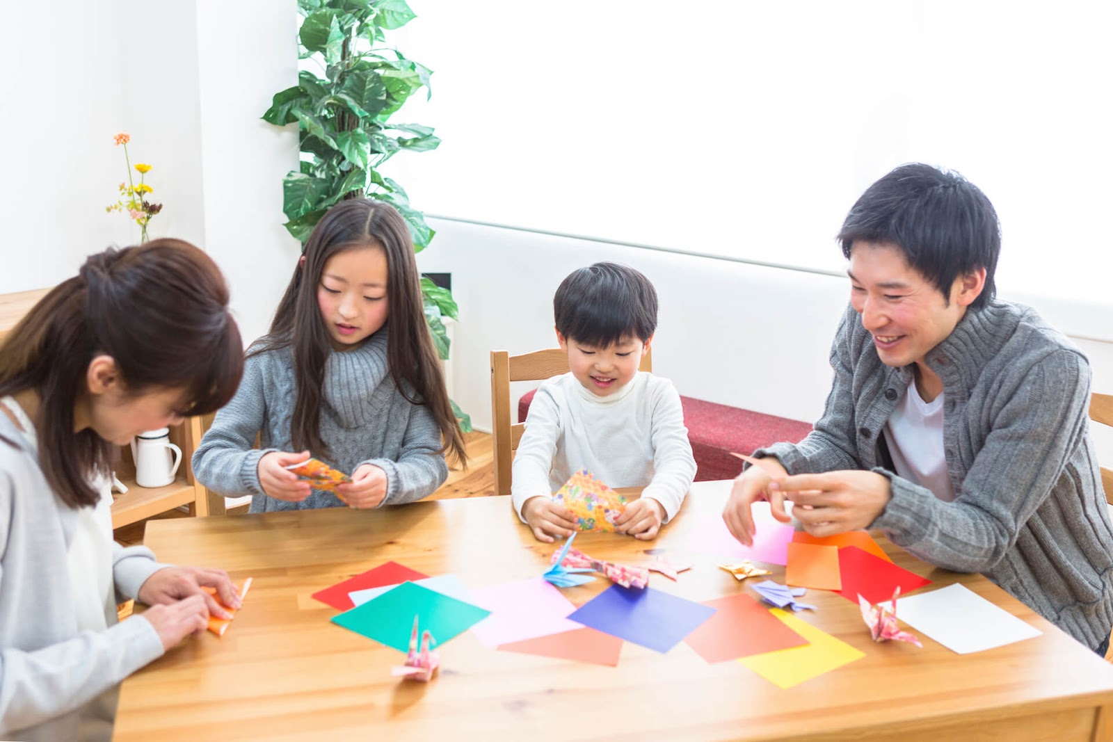 Family learning origami together