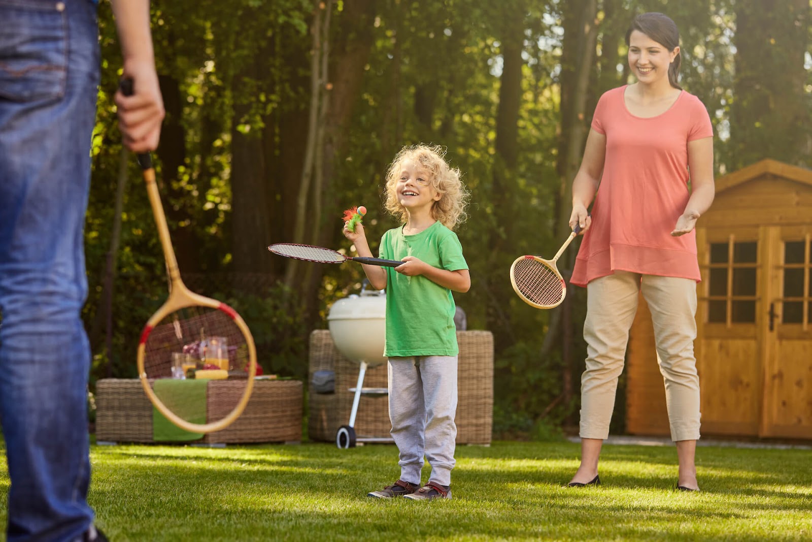 Family playing badminton