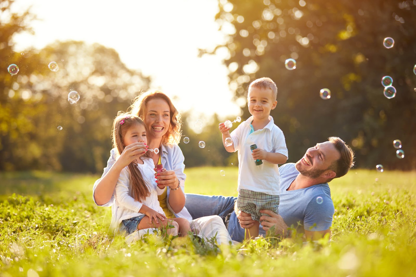 Family playing with bubbles