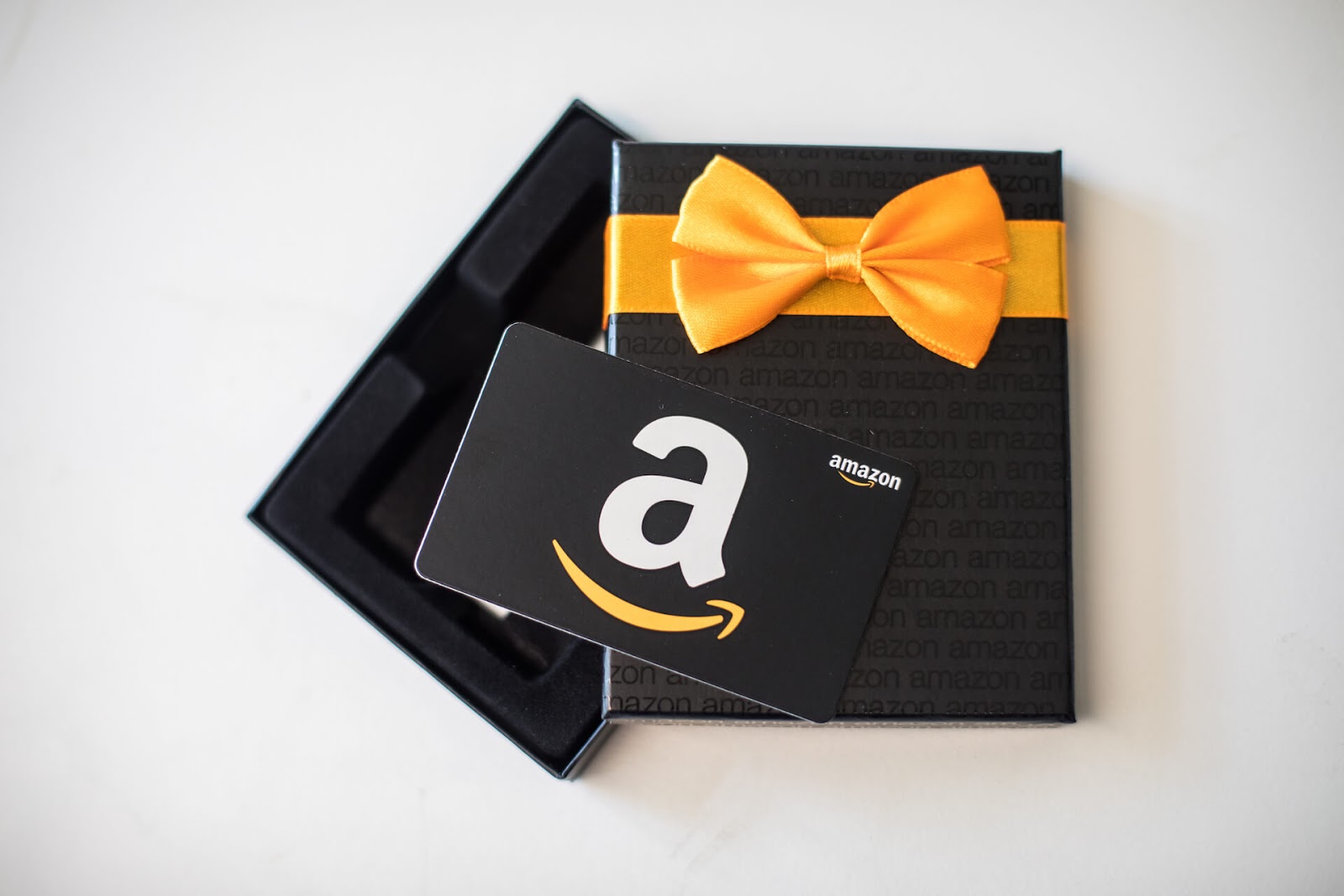 Box with an Amazon gift card in front of it