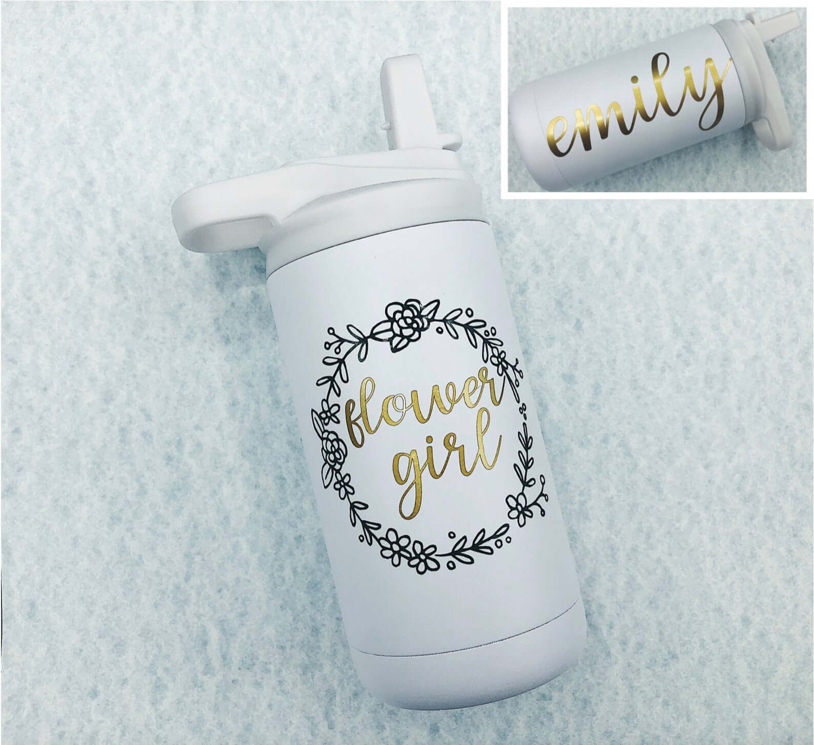 White water bottle with gold lettering on the side and "Flower girl" on the front