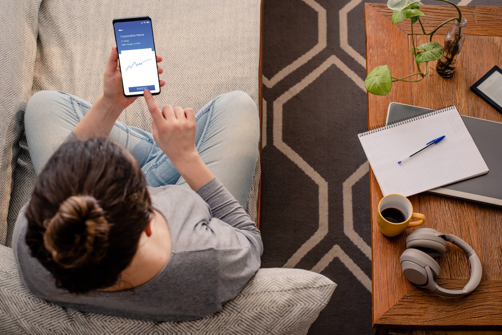 Woman looking at some investment options on her phone