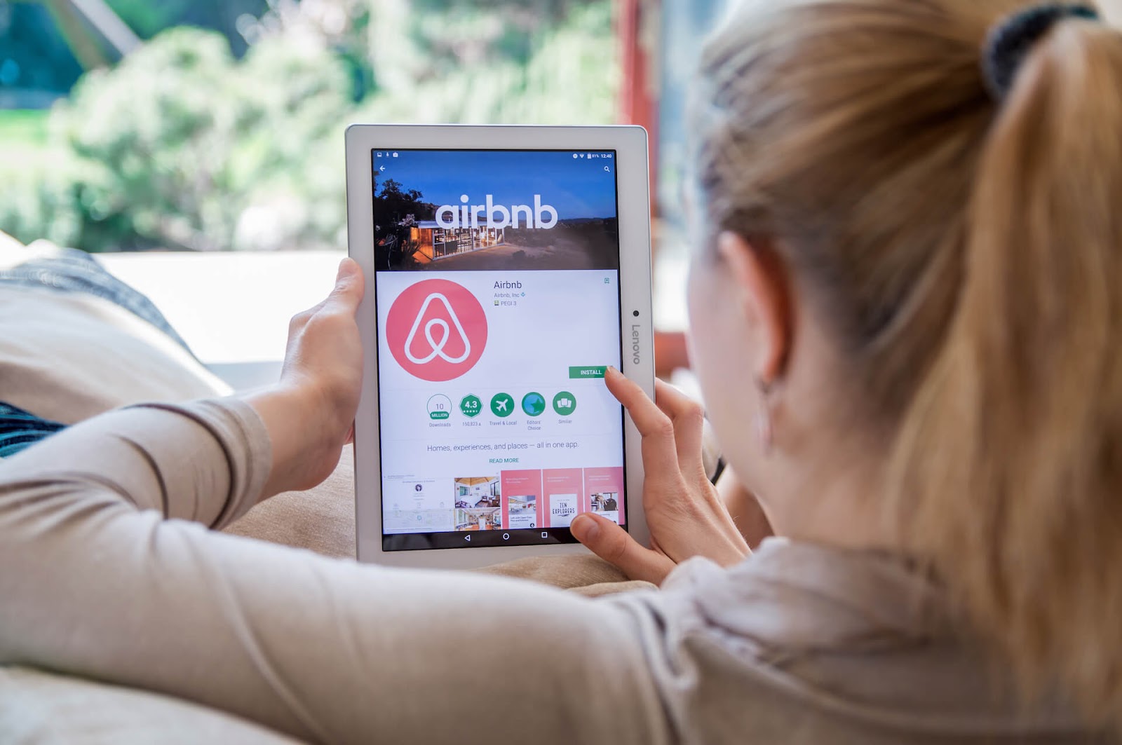 Woman setting up an account with Airbnb
