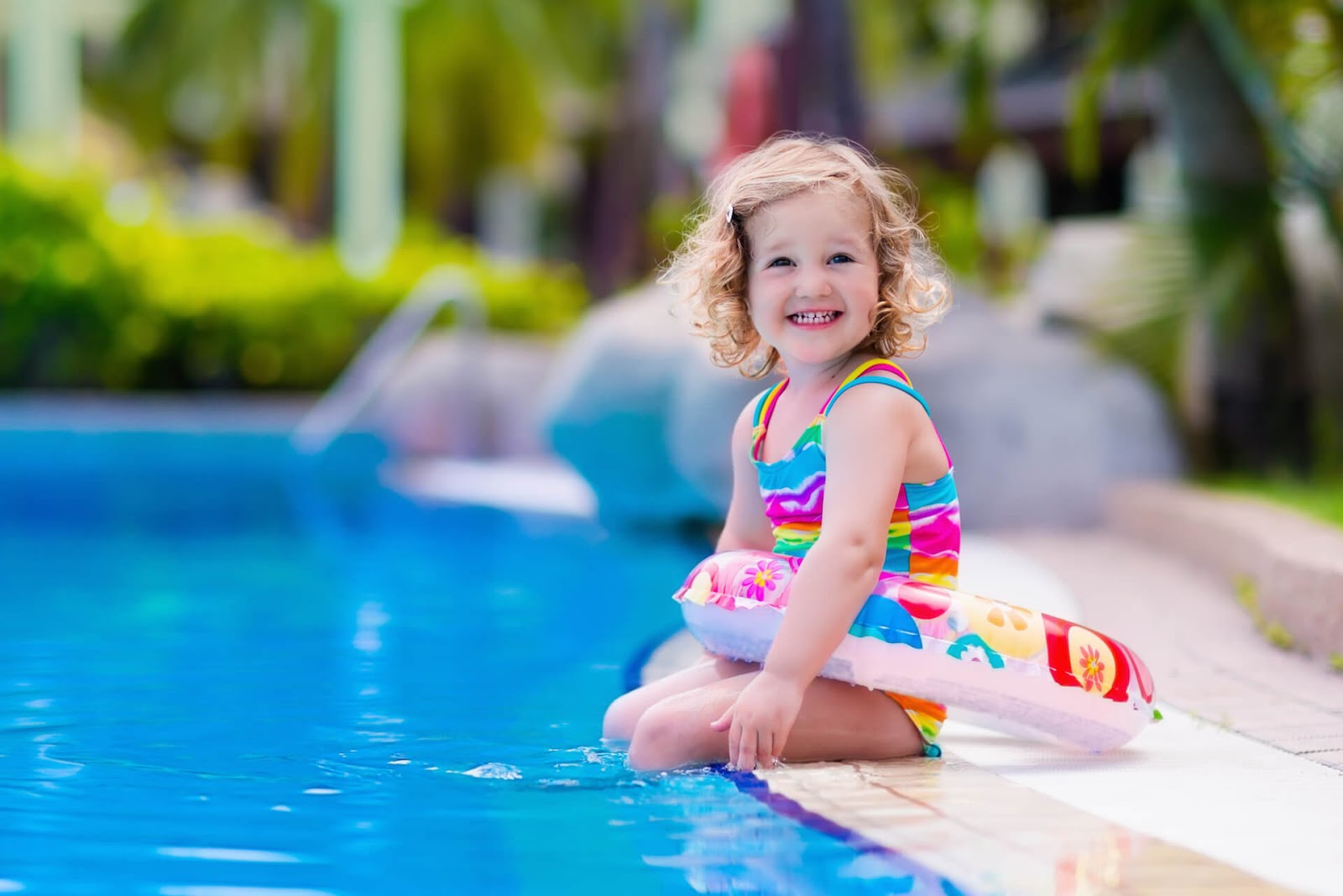 Young girl with floatie around her waist