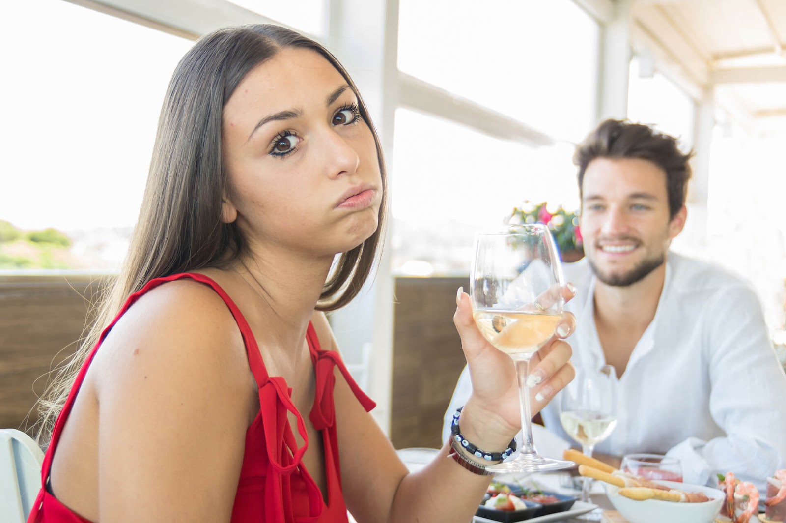 Woman with bored expression on a date