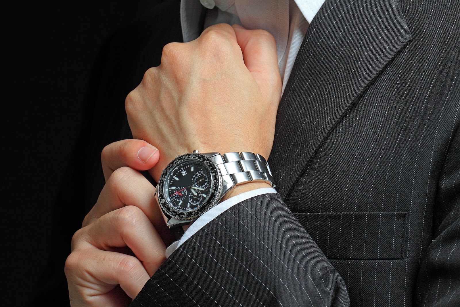 Man with dress watch on his hand