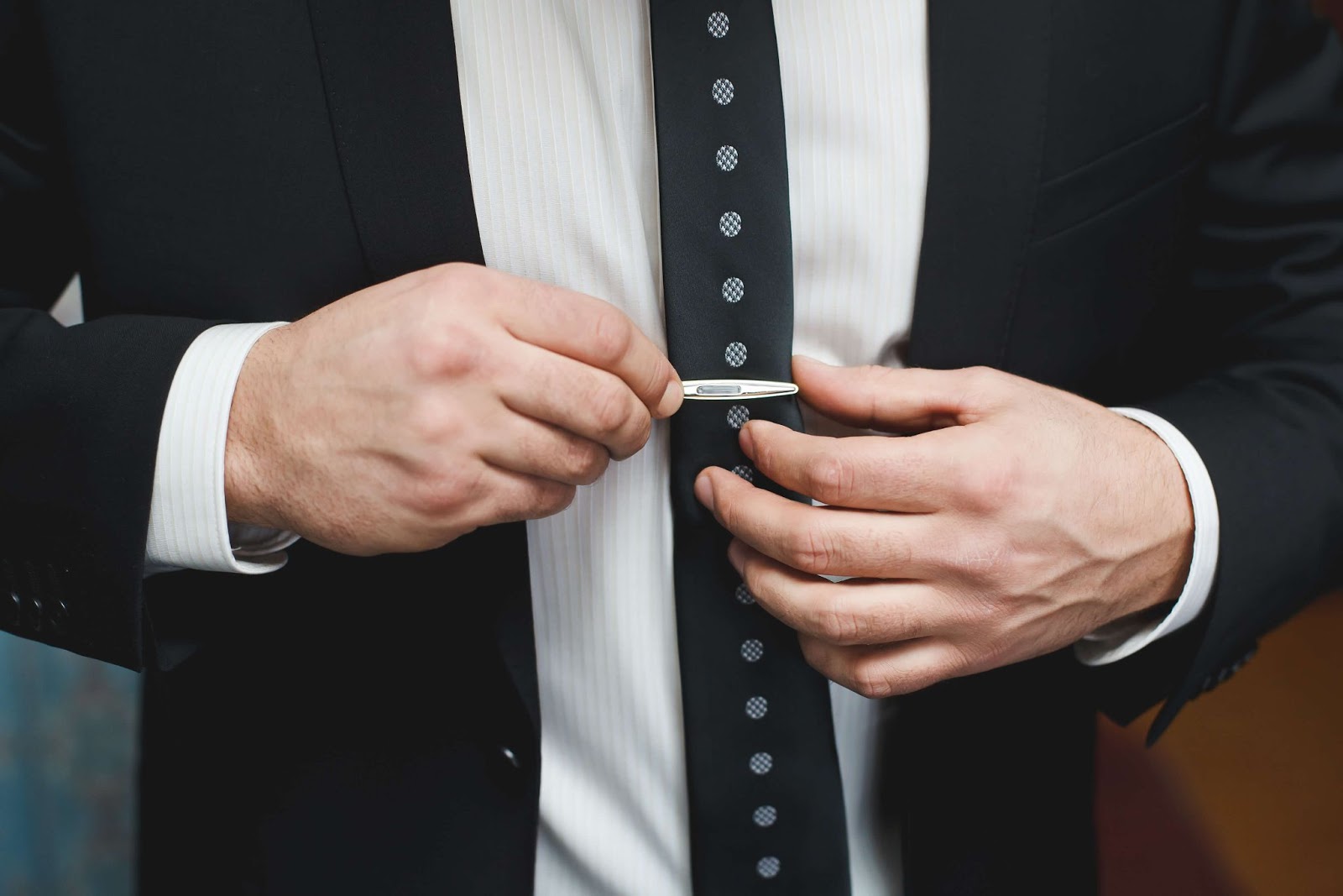 Man putting on a Tie Clip