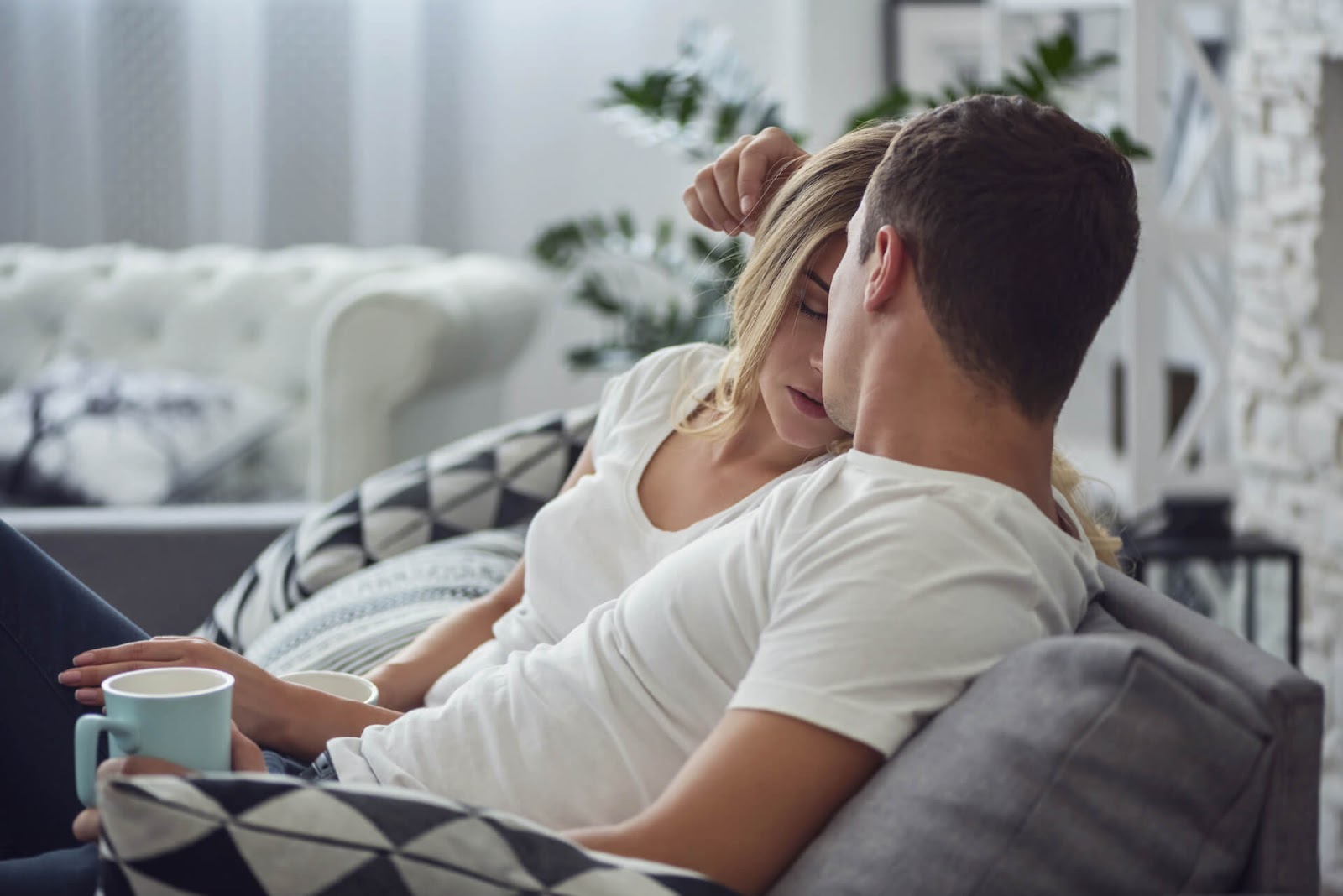 Man comforting his discouraged and tired wife