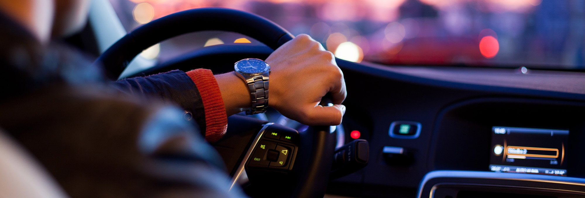 Hand on steering wheel