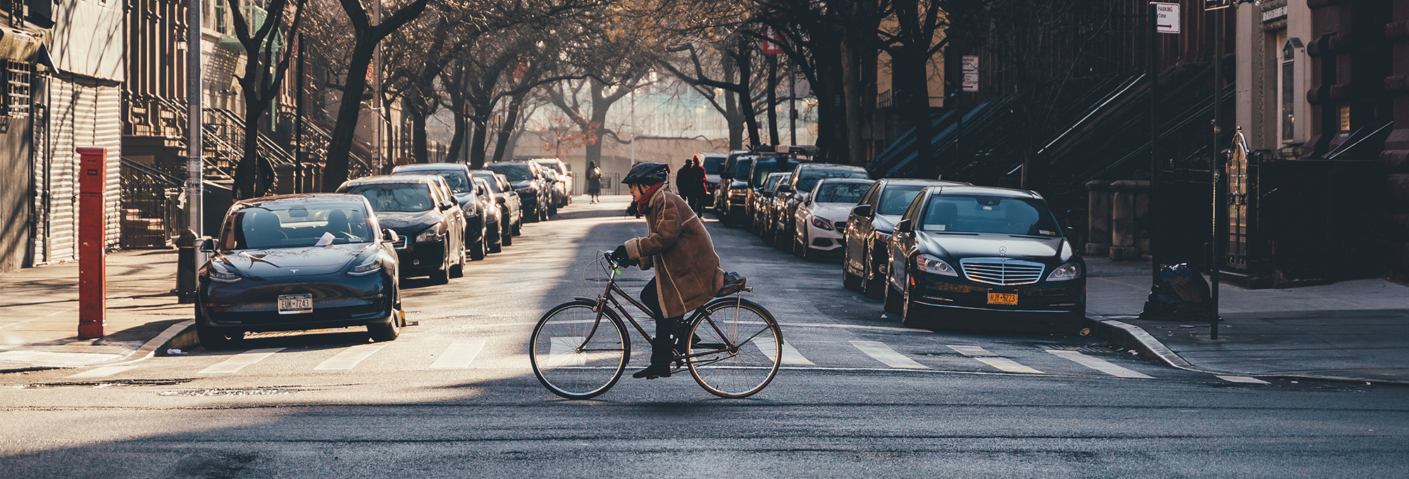 Person on bicycle crossing street