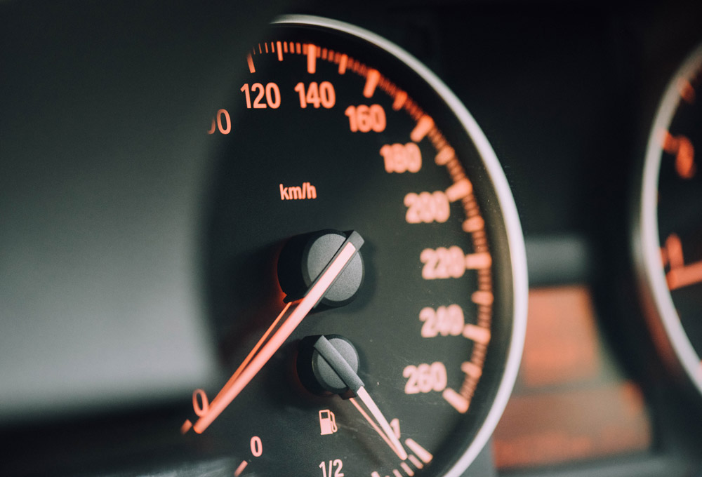 Car speedometer on dashboard