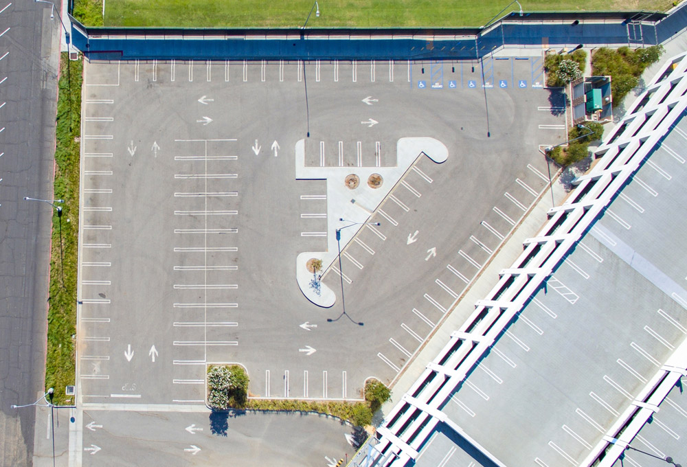 Aerial view of square empty parking lot