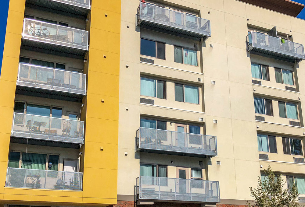 Yellow multi-floor apartment complex