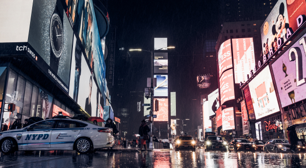 Busy Times Square in New York City with cars and pedestrians