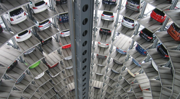 Tall vertical parking garage with parked cars