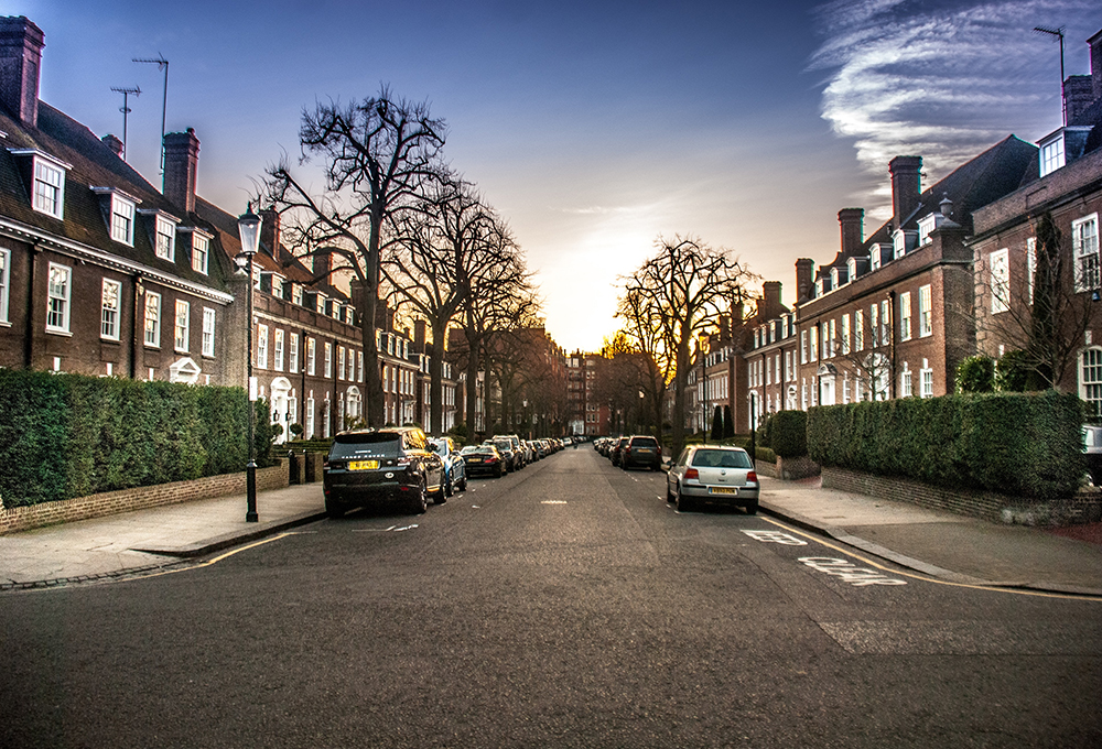 Cars parked on quiet residential street in London