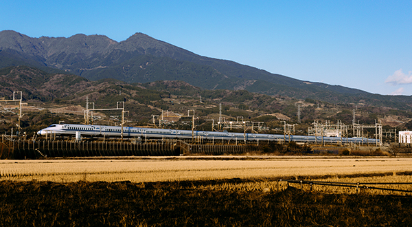 Train in Japan with mountains in the backgroud