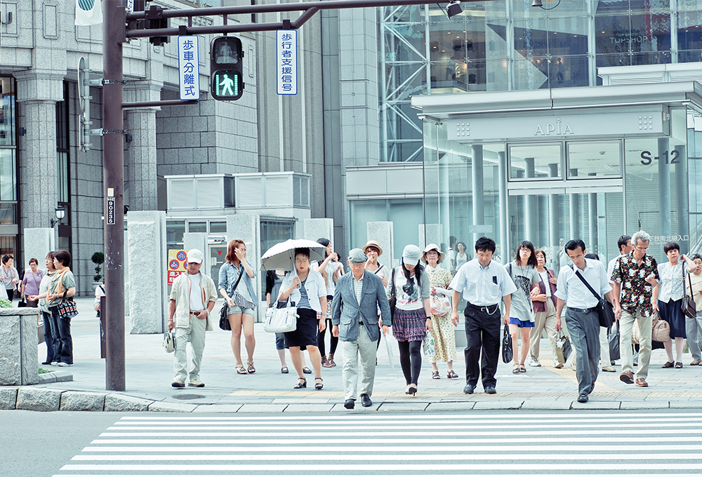 Group of people crossing a street in Sapporo, Japan