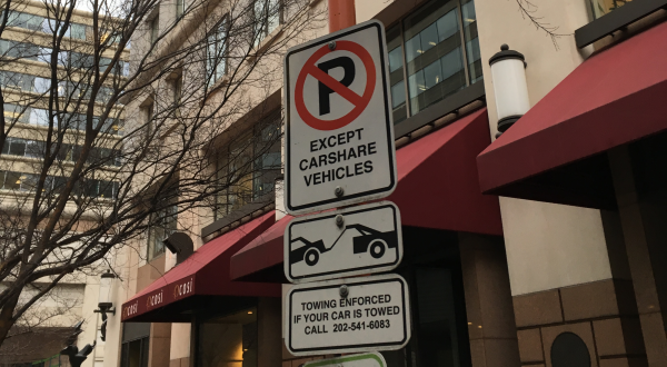 Damp street sign designating car2go parking