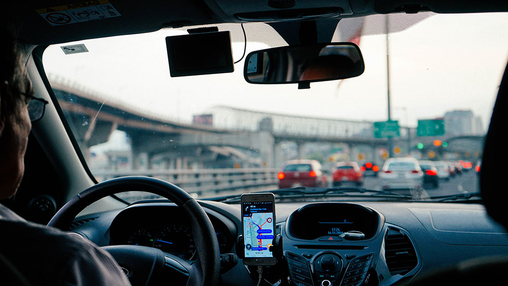 View of a TNC driving on the freeway from the perspective of a rider. 