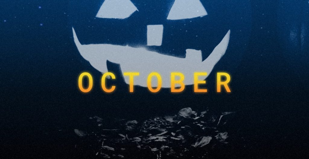 Gray image of a jack-o-lantern with the word October in yellow in the middle of the image