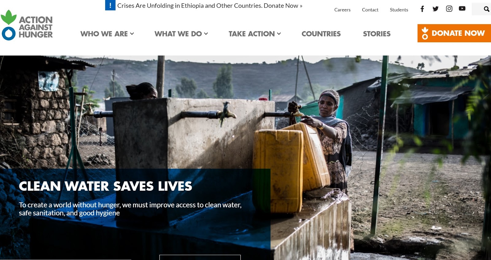 Action Against Hunger homepage with a picture of a woman getting water and a big orange DONATE NOW button in the top right.