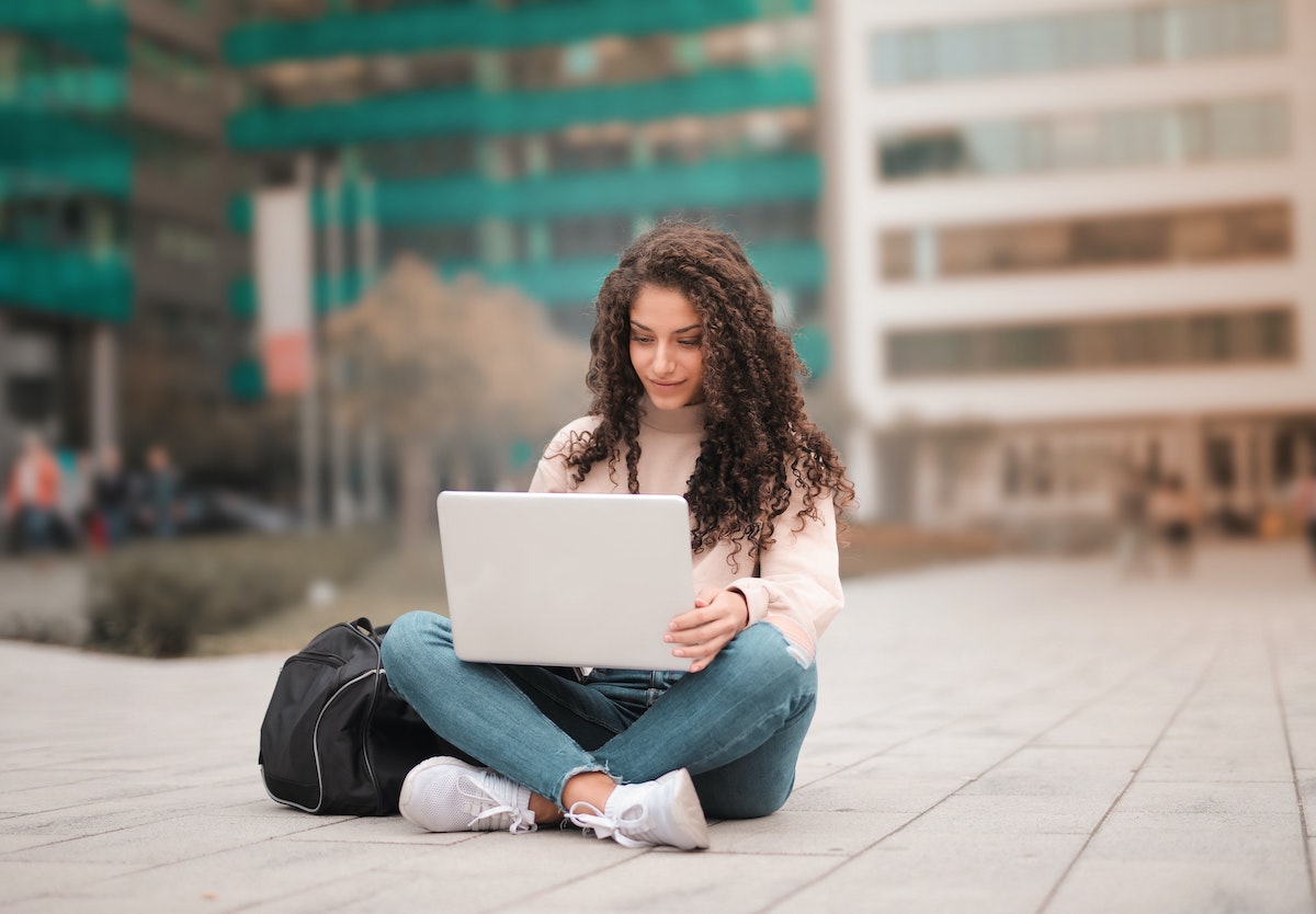 Woman sitting using laptop