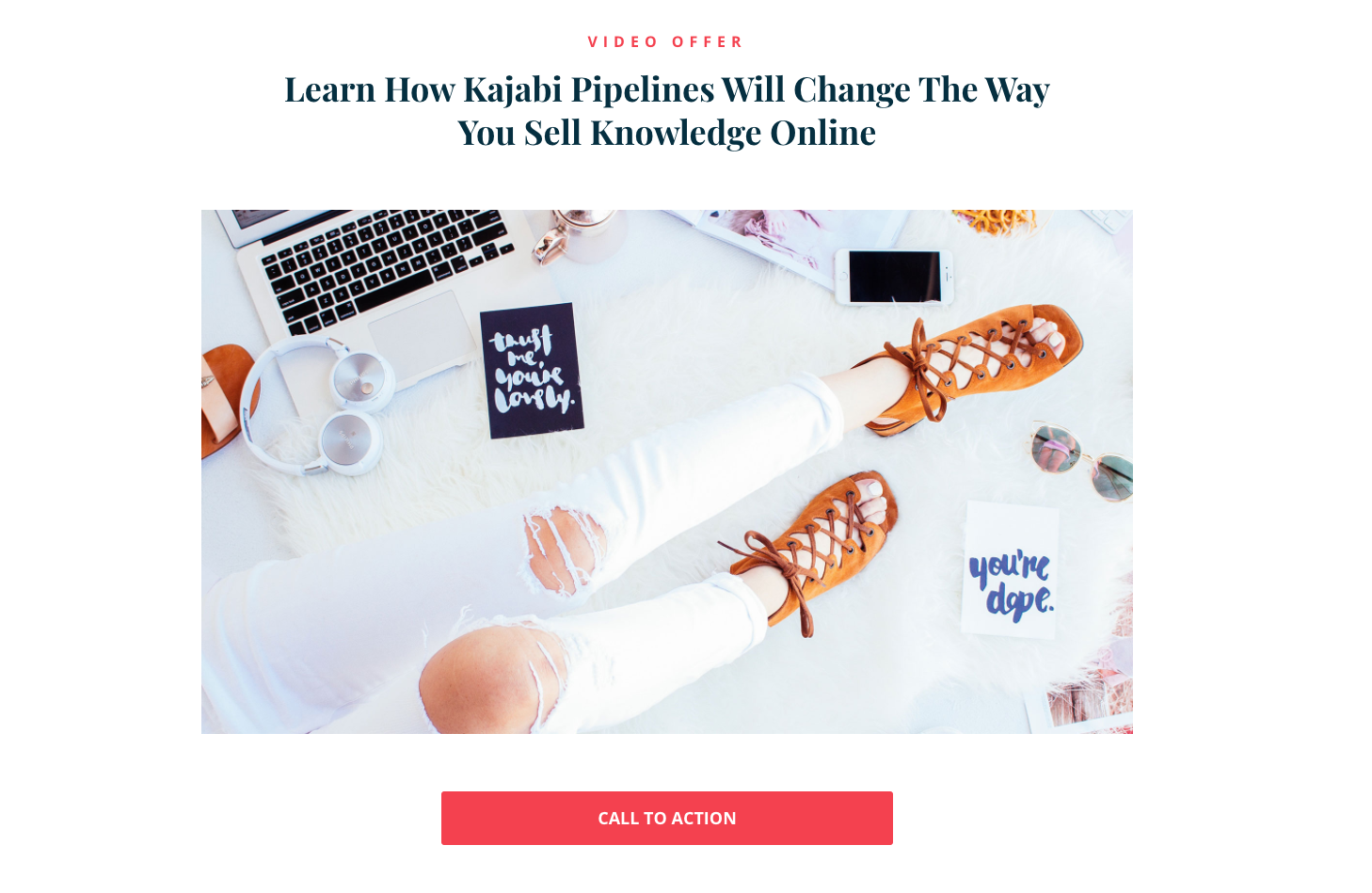 Kajabi landing page with an image of a person’s legs and office equipment above a fuchsia call to action button