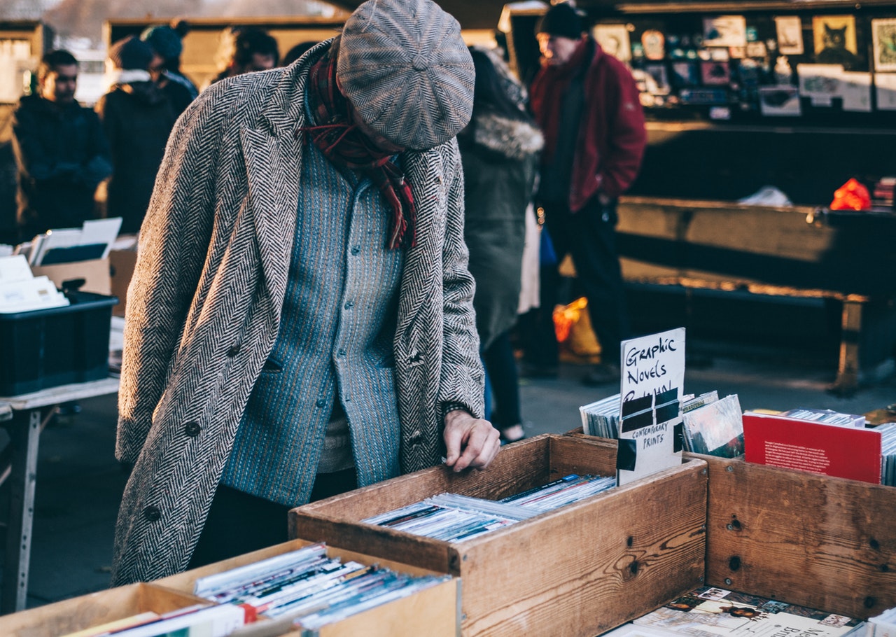 person browsing through graphic novels