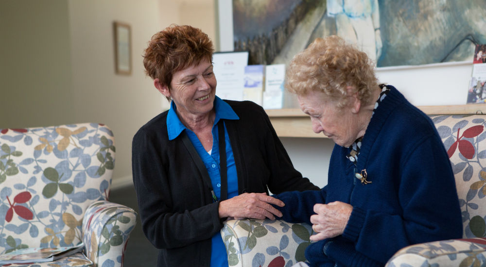 elderly woman with carer in home