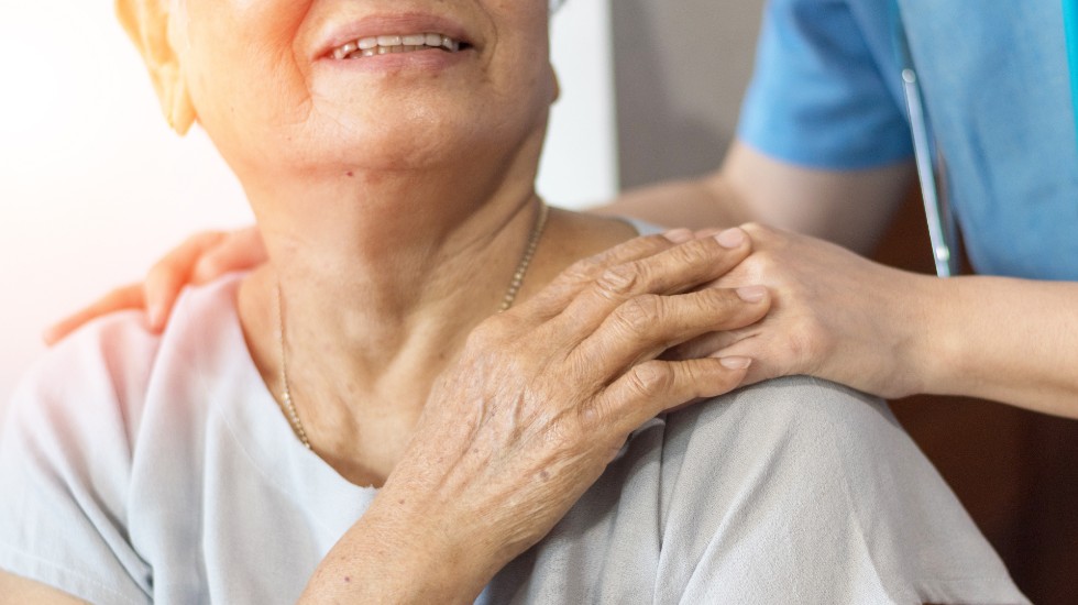 eledrly woman being comforted