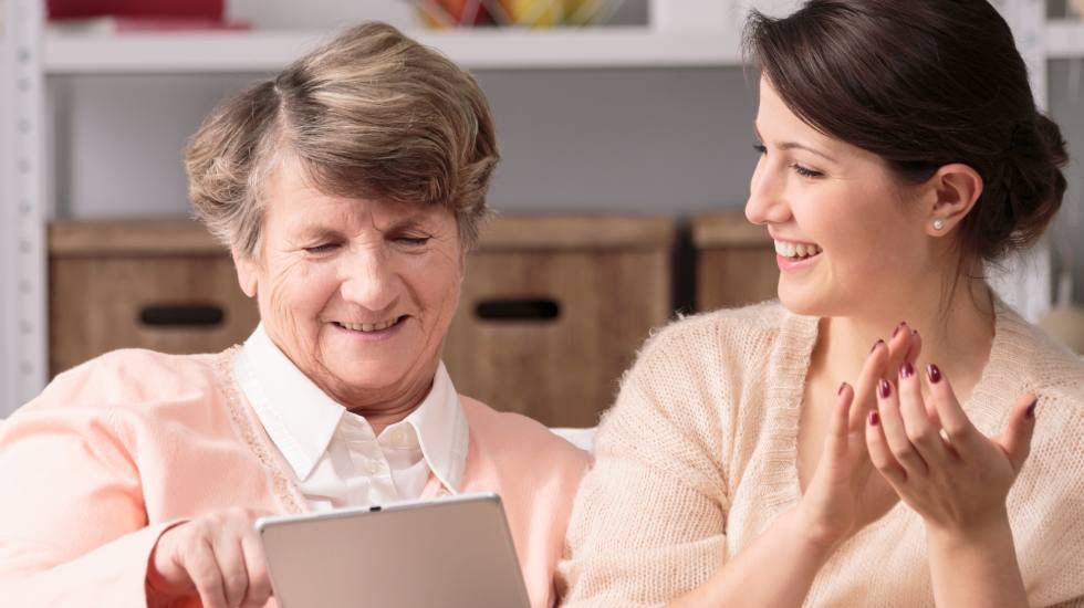 Two women using an iPad together