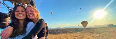 Employee riding a hot air balloon with their Blueboard reward.