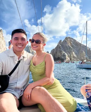 Couple on a catamaran in tropical location.