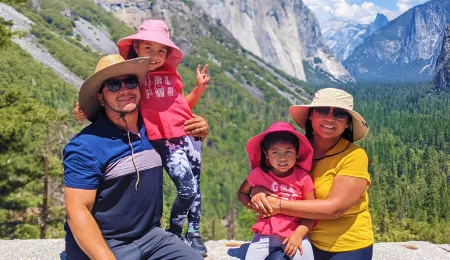Family posing in front of Yosemite Valley's tunnel view.