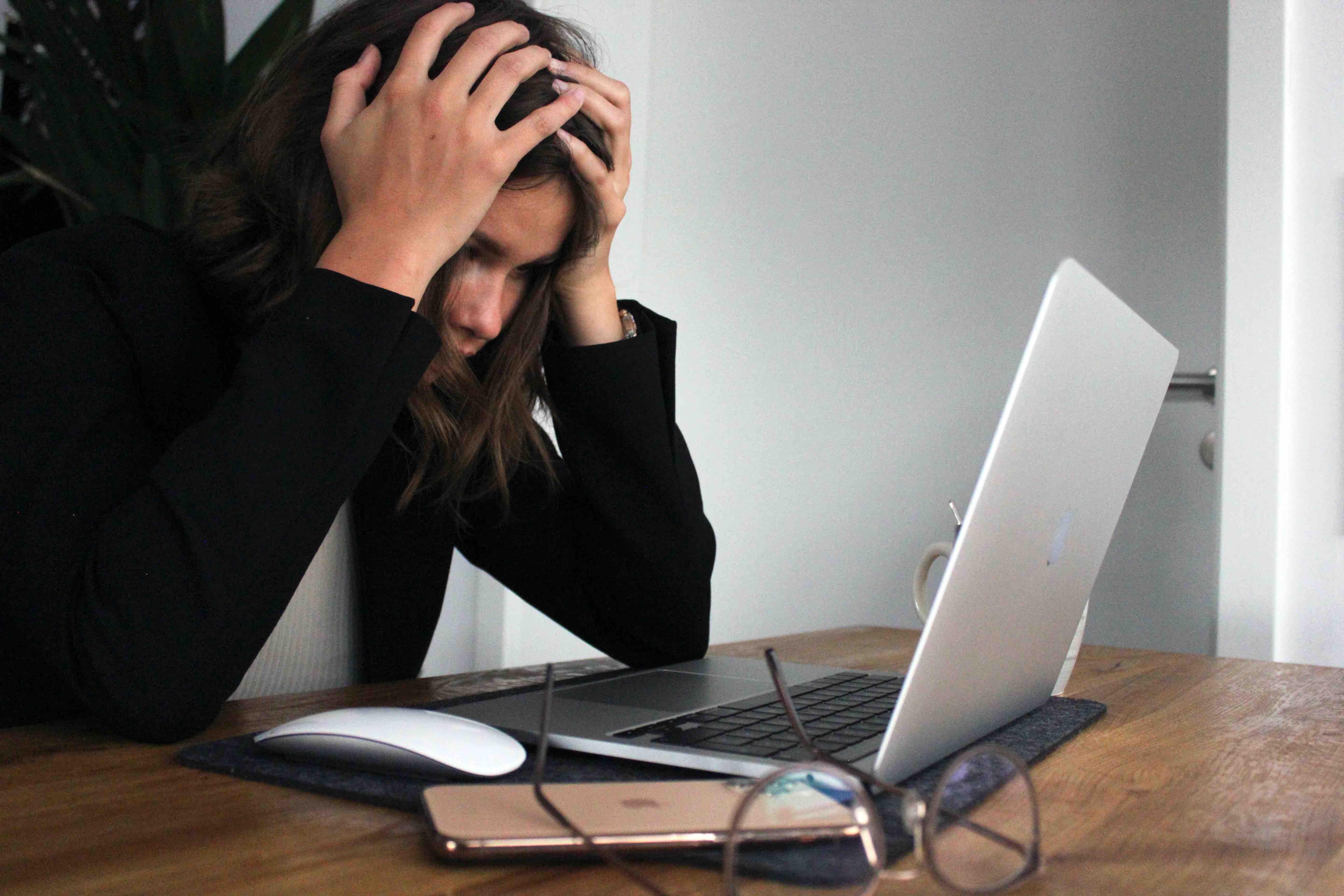 An employee frustrated sitting at her desk