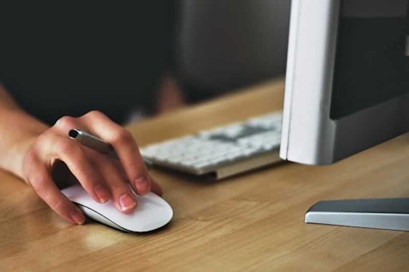 A person researching information on a desktop