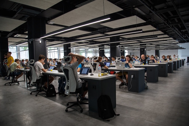 A large office with employees at their computers