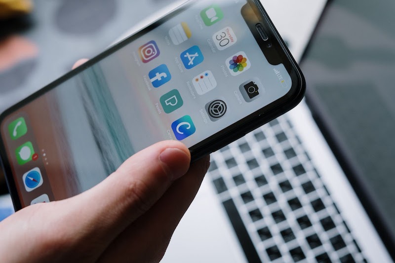 A mobile phone with multiple apps showing