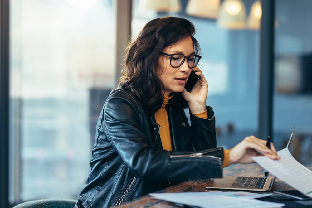 Asian Businesswoman Working at Desk Focused