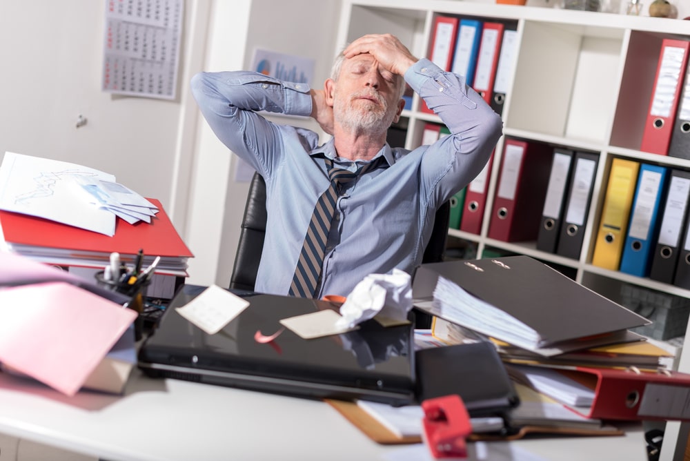 Older White Man Stressed At Work