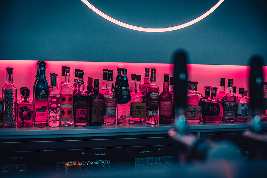 A selection of drinks behind a bar