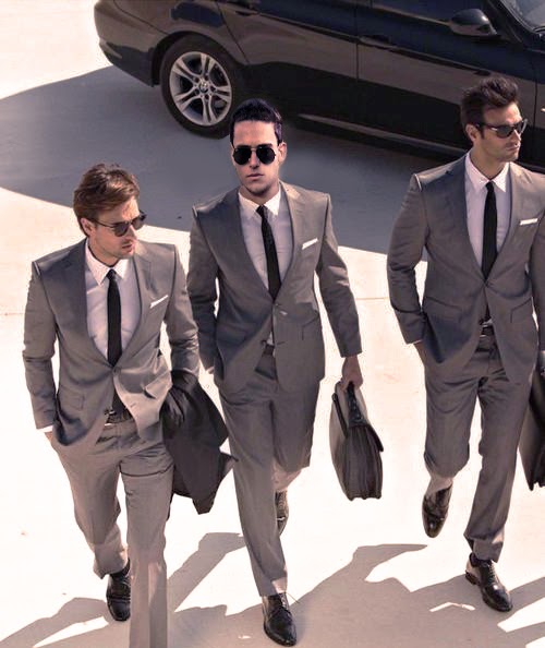 three businessmen in suits