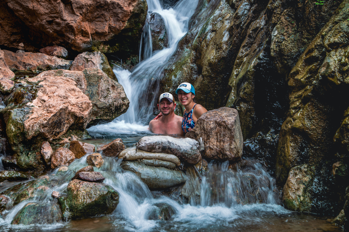 Man and woman soaking in Las Vegas hot springs