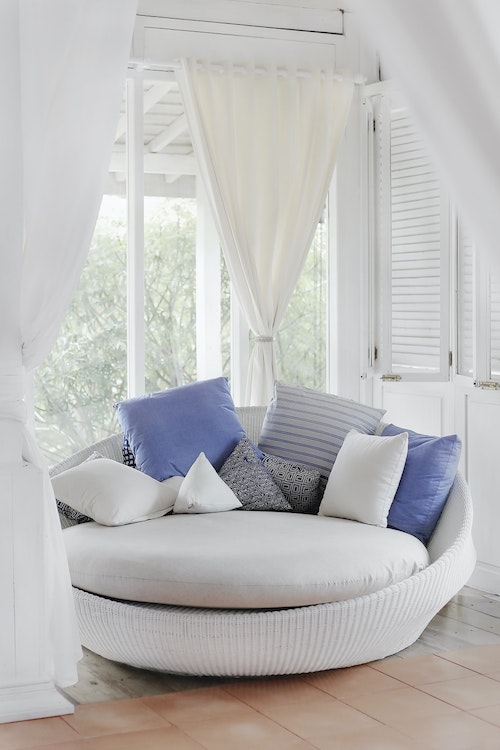 clean curtains next to clean couch