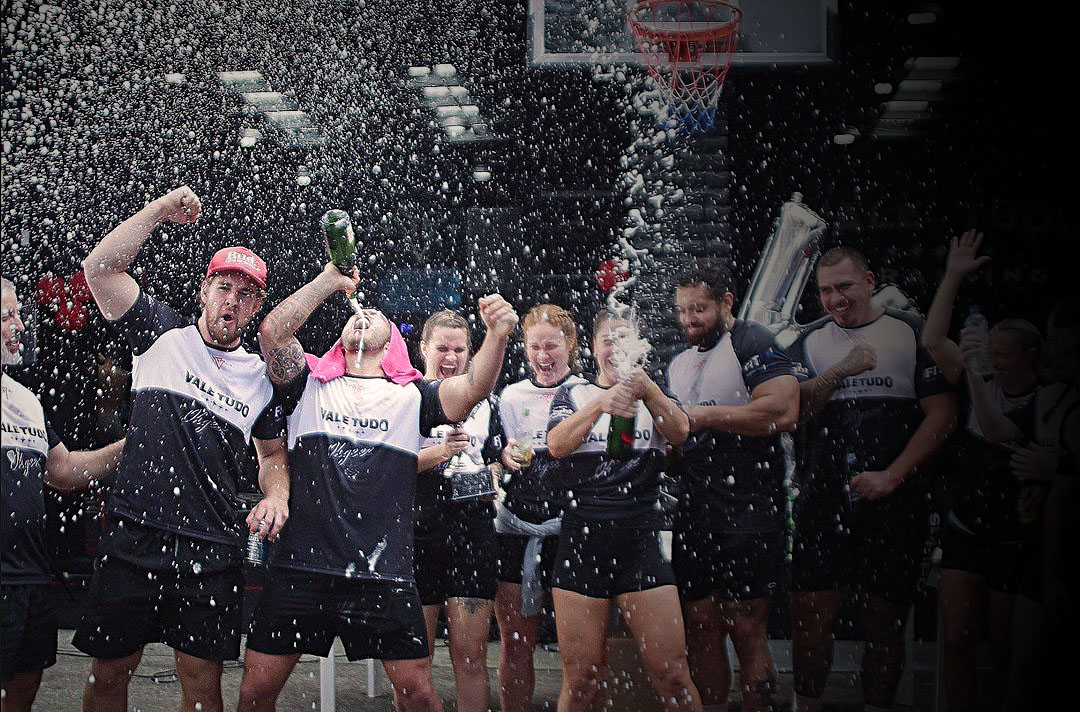 Vale Tudo Training Botany team celebrate their VT Games win with a champagne spray